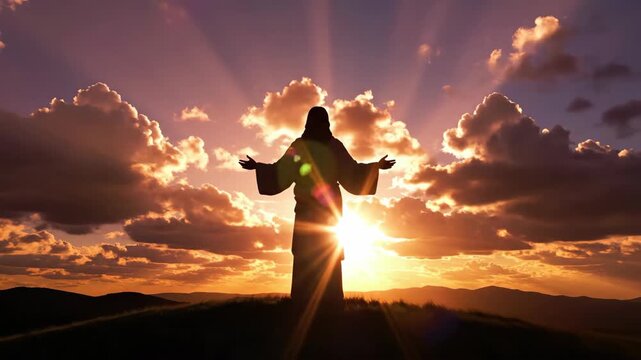 Jesus Christ silhouette standing on a hill crest with arms outstretched at sunset. Spiritual religious concept of faith and worship. Cinematic sun rays and clouds in the sky