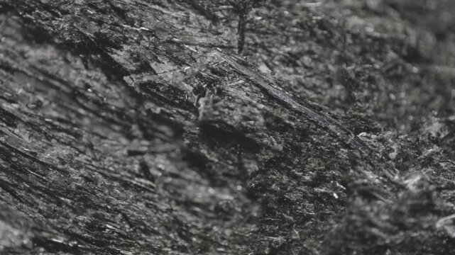 4k macro shot. Enlarged crystal aegirine from Khibiny: fibrous intergrowths and euhedral black crystal, captured via microscope objective, 2&times;, 15 mm FOV