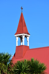 Steeple of wooden church with red iron roof &acirc;&euro;&ldquo; architecture typical for early New Zealand buildings. Location: Auckland New Zealand