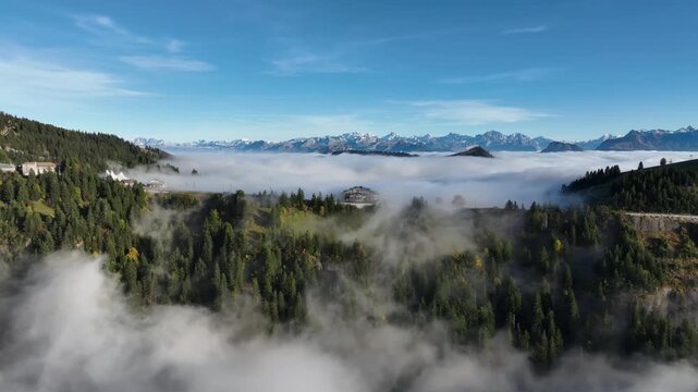 Aerial panorama of green apine ridge and vast cloud ayer