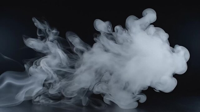 Swirling white vapor erupts against a dark, atmospheric background