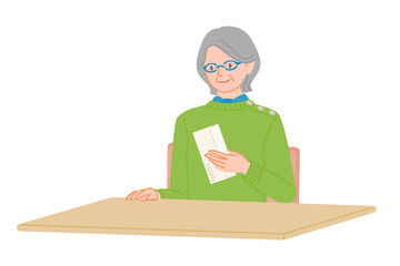 Senior Woman Checking an Envelope at a Desk