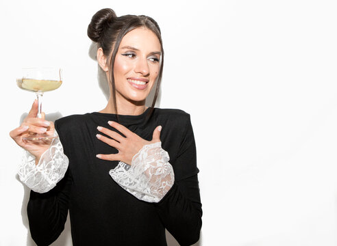 Party time. Happy Woman In Fashion Dress With Champagne 