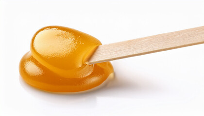 Liquid Yellow Sugar Paste Or Wax For Depilation On A Stick Close Up On A White Background