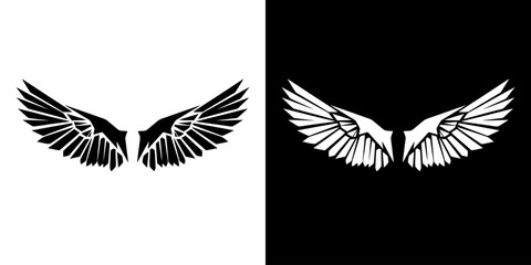 Fototapeta premium Graphic illustration of white and black bird wings on split white and black backgrounds.