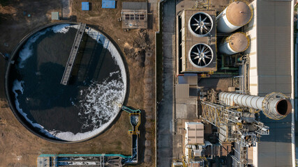 Obraz na płótnie Canvas Aerial view municipal wastewater treatment plant. Circular sedimentation tanks or biological reactor, Water cleaning facility wastewater treatment plant, Water treatment plant.