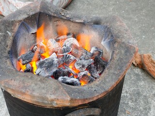Burning Charcoal in Traditional Stove for Heat Energy and Cooking Concept