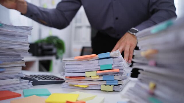 Accountant who is Preparing a Tax Document and Paperwork calculation for Financial Analysis in a Business Management process for an Accounting Audit