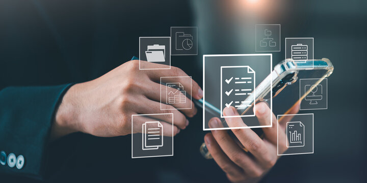 A person uses a smartphone with digital document icons floating, featuring checklists, folders, data files&mdash;representing mobile access to cloud-based document systems and smart productivity tools.