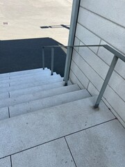 Public stairs with a metal handrail