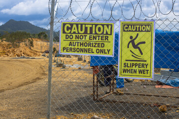 Safety First: Industrial Warning Signs at a High-Security Construction Site