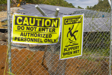 Safety First: Industrial Warning Signs at a High-Security Construction Site