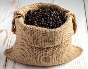 Black peppercorns spilling from a rustic burlap sack on wooden surface
