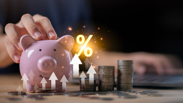 Piggy bank with rising coin stacks ,interest rate symbol savings growth, interest rate increase, financial planning, investment returns, inflation impact, banking, personal finance strategy.