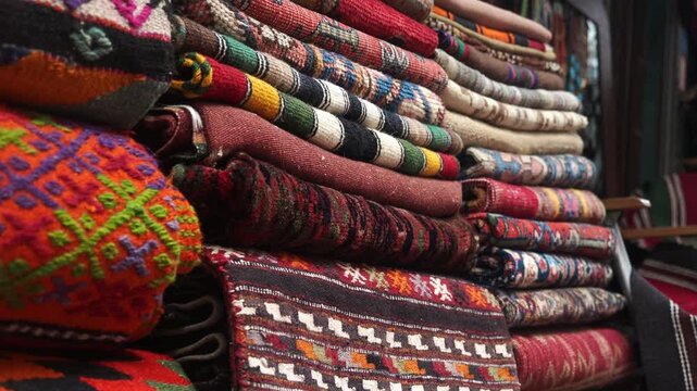 Colorful textiles stacked for sale in local market