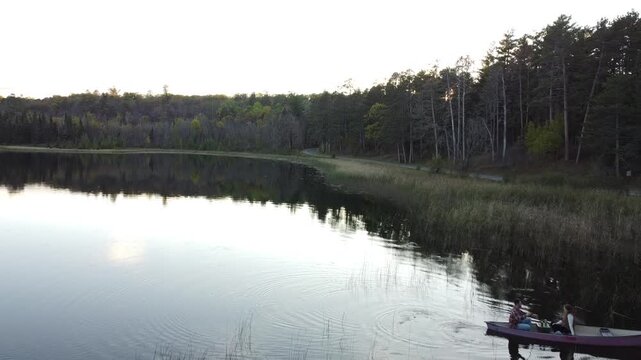 Aerial Pan Over Calm Lake Water at Lake Itasca Minnesota
