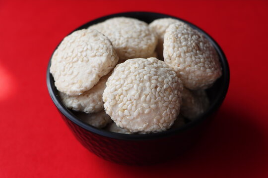 Revadi (also spelled Revdi or Rewari) is a popular, crunchy Indian sweet candy made primarily from sesame seeds (til) and jaggery (gud) or sugar. It is a traditional winter staple in North India