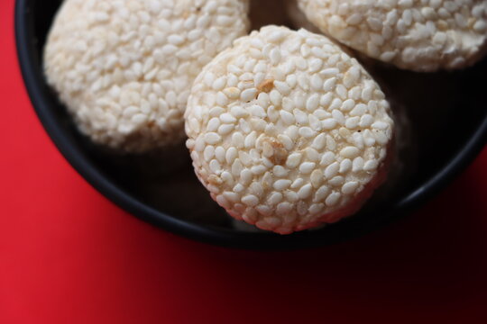 Revadi (also spelled Revdi or Rewari) is a popular, crunchy Indian sweet candy made primarily from sesame seeds (til) and jaggery (gud) or sugar. It is a traditional winter staple in North India