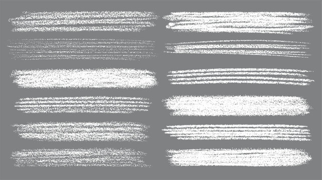 Collection of twelve white chalk brush stroke textures on a grey background