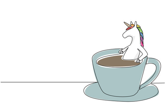 One line drawing of adorable unicorn features fantasy animal soaking in coffee cup for nature concept. Colorful fairytale horse art is ideal for an international coffee day theme and girl room decor