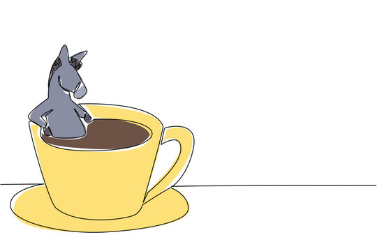 Single line drawing of adorable donkey for nature concept features cute animal soaking in warm coffee cup. Colorful graphic celebrates an international cafe day theme with the grey farm animal