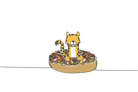 One line drawing of adorable cheetah features wild fast animal sitting inside sparkled donut for sweet pastry concept. Colorful art ideal for international food day theme and kids bedroom decoration