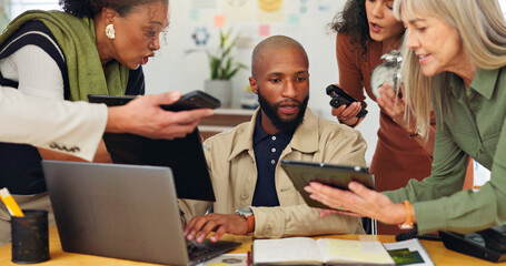Man, team and crisis with laptop at office for deadline, multitasking and stress for time management. Person, group and frustrated with chaos, report or overwhelmed with project at creative agency