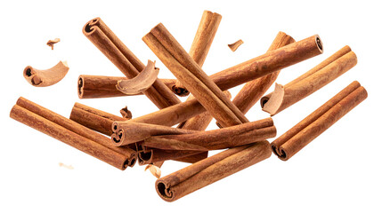 Close-up of cinnamon sticks and cloves scattered against a transparent background