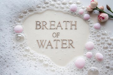 Close up of bubbles and text Breath of Water flatlay view