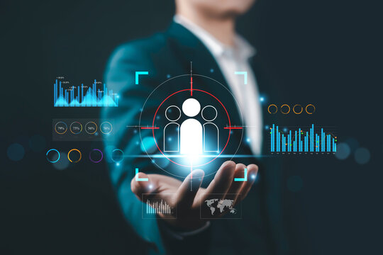 Business professional presenting digital human resources analytics with virtual interface, people management concept, customer targeting, HR technology, data driven strategy and corporate innovation.