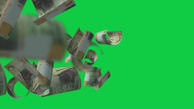 Jordanian 1 dinar flying slowly against a green background