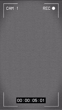 Security camera recording overlay with static glitch screen effect. 4k vertical video