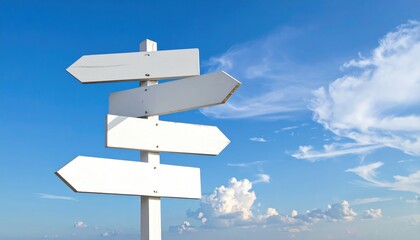Empty signpost with multiple arrows pointing in different directions under a bright blue sky.
