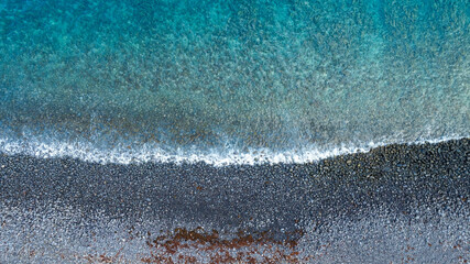 Top View of Crystal Clear Sea and Pebble Beach (