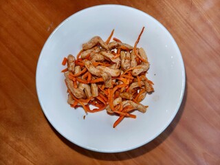 Spicy soy asparagus and carrot salad in white bowl. Fresh Asian cuisine dish with vegetable. Healthy food oriental meal for menu.