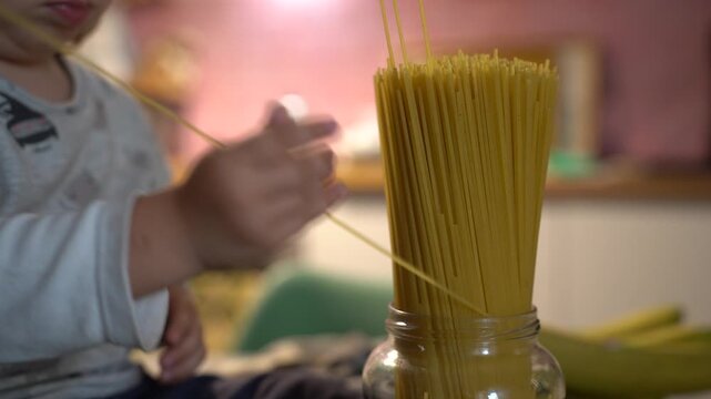 Toddler Playing with Spaghetti in a Jar, Sensory Play Activity for Young Children