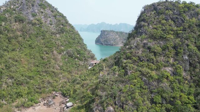 Spectagular Drone View to karst Mountain with the waters of Ha Long Bay near Cat Ba Island, Vietnam. 