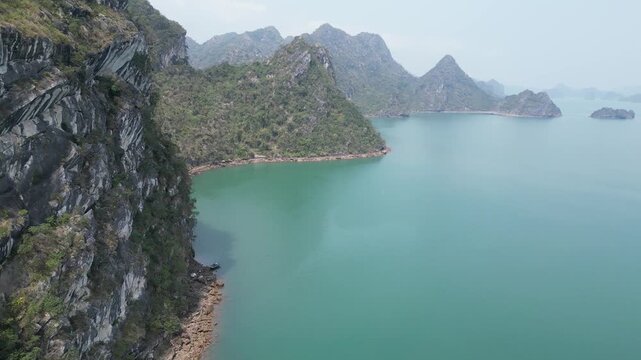Drone view to karst mountains with the waters of Ha Long Bay near Cat Ba Island, Vietnam. 