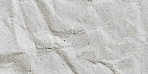 Obraz premium Texture detail of a crumpled paper sheet, featuring a rustic and textured appearance. The paper shows visible creases, folds, and subtle imperfections.