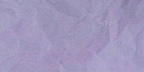 Obraz premium Abstract texture of crumpled lavender paper, creating a textured background and artistic touch. The paper has a textured surface with irregular folds, creases, and patterns. 