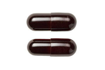 Two dark brown capsules, top view
