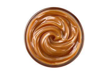 Caramel sauce swirls in a clear glass bowl