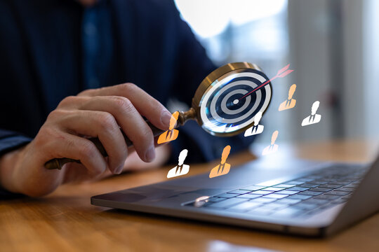 Business professional analyzing target audience with magnifying glass, customer segmentation, people analytics, recruitment strategy, lead targeting, human resources, marketing analysis, and business 