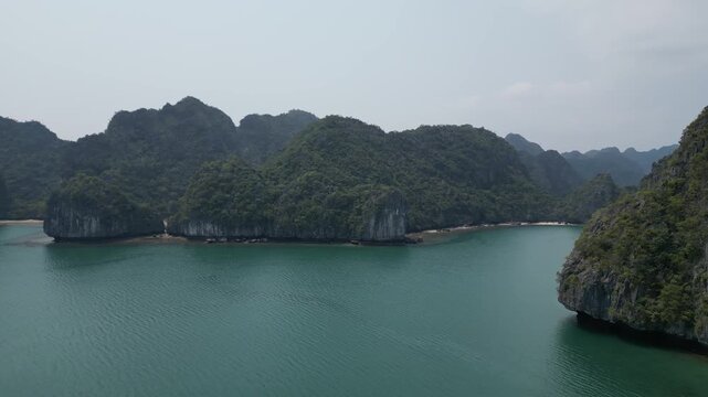 Drone view to karst mountains with the waters of Ha Long Bay near Cat Ba Island, Vietnam.