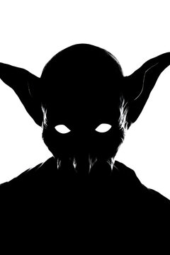 Black silhouette goblin head facing forward with evil eyes in tabletop fantasy style