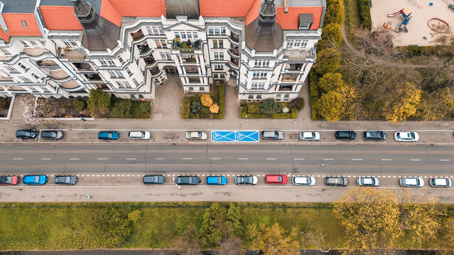 Street parking beside buildings and park