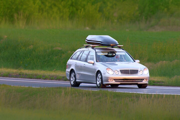 Fototapeta premium Sporty vehicle on asphalt countryside road
