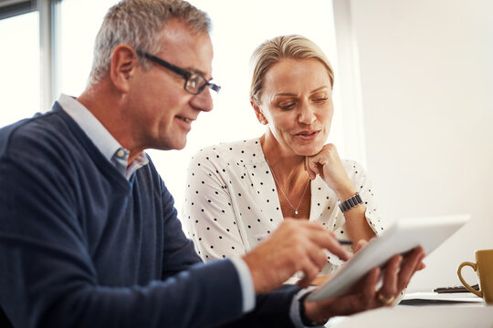 Review, tablet and mature couple in home for planning, life insurance research and financial security. Policy info, support and people with tech to reading benefits, premium price and talk for choice
