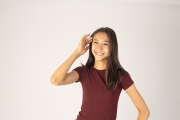 Fototapeta premium Young woman touching her face and smiling