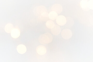 Obraz premium Luxury holiday background with glittering gold particles, sparkling bokeh, and abstract light effects ideal for New Year celebration, festive illustration, and party designs.